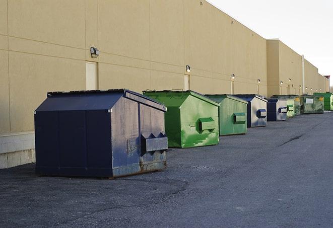 construction dumpsters on a worksite surrounded by caution tape in Scotchtown